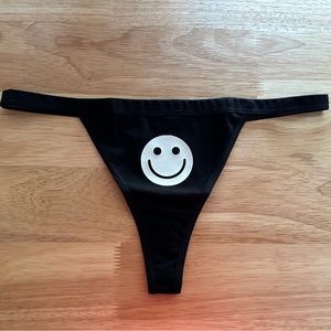 NWOT Sexy Black Thong Underwear with White Glow in the Dark Happy Face Print